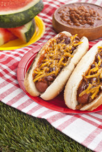 Two Grilled Chili Hotdog Sandwiches In Plate