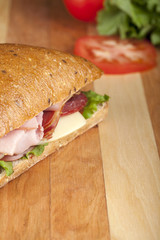 Poster - cropped ham sandwich in kitchen table