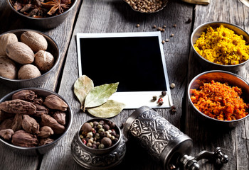 Wall Mural - Spices and blank photo at the table