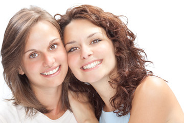 beautiful young girl couple hug smile isolated on white