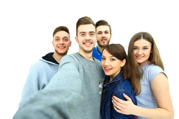 Canvas Print - Group of happy young teenager students taking selfie photo isolated on white background