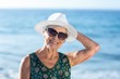 Senior woman posing with sunhat