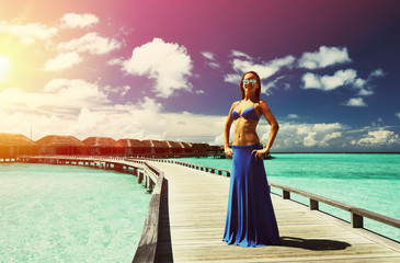 Sticker - Woman on a beach jetty at Maldives