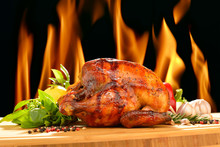 Roast Chicken And Various Vegetables On A Chopping Wood