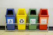 Different Colored wheelie bins set with waste icon