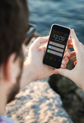 Poster - Man with sunglasses using  smartphone with notifications near th