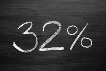 Wall Mural - 32 percent header written with a chalk on the blackboard