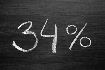 Wall Mural - 34 percent header written with a chalk on the blackboard