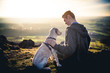 canvas print picture - Dog and man in landscape