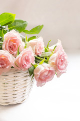 Wall Mural - Beautiful, pink roses in a white basket close up