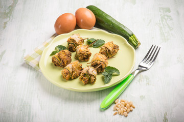 Canvas Print - filled rolled up zucchinis with pine nuts