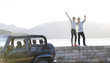 © Blue Jean Images - Happy young men and jeep