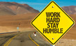 Work Hard Stay Humble sign on desert road