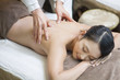 © Blue Jean Images - Young woman receiving shiatsu massage