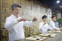 Chinese Doctors In Traditional Chinese Medicine Pharmacy