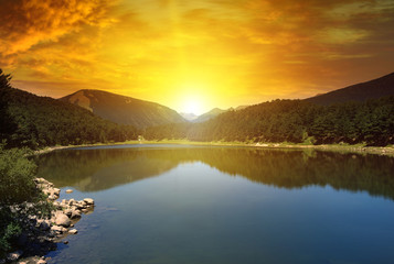 Canvas Print - sunrise over lake and mountains