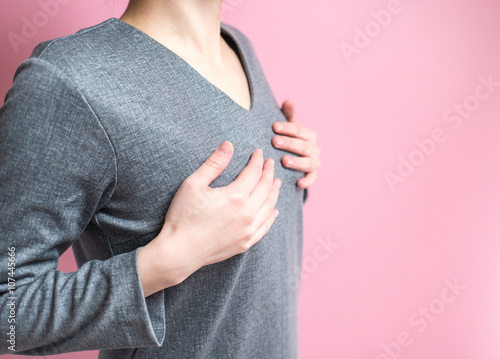 胸を押さえる女性 Stock Photo Adobe Stock