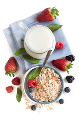 Wall Mural - Rolled oats in a bowl with berries and milk