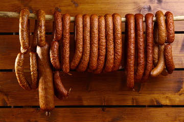 Wall Mural - sausage on wooden background 