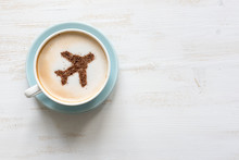 Airplane Made Of Cinnamon In Coffee. Cup Of Cuppuccino. Travel Concept