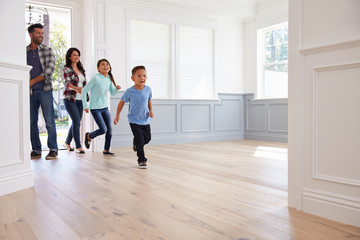 Hispanic Family Viewing Potential New Home