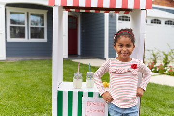 Wall Mural - Portrait Of Girl Running Homemade Lemonade Stand