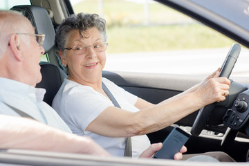 elderly couple travelling