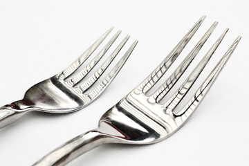 closeup of two forks on the table