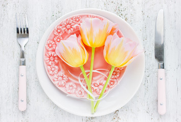 Festive table setting with beautiful tableware set and flowers