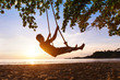 © Song_about_summer - swing on paradise tropical beach at sunset, happy people enjoying summer