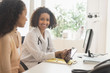 © JGI/Tom Grill/Blend Images - Doctor and patient using digital tablet in office
