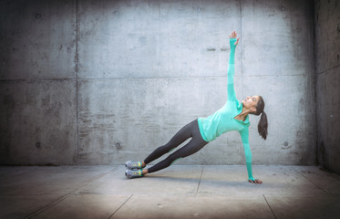 Young woman performing yoga exercise 