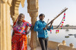 © Inuk Studio/Blend Images - Traditional Indian couple standing in monument, Jaisalmer, Rajasthan, India