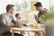 © JGI/Tom Grill/Blend Images - Caucasian gay fathers and baby eating breakfast