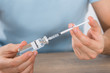Man Holding Insulin And Syringe