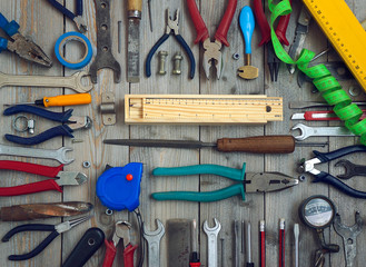 Wall Mural - Tools on a wooden floor, top view.