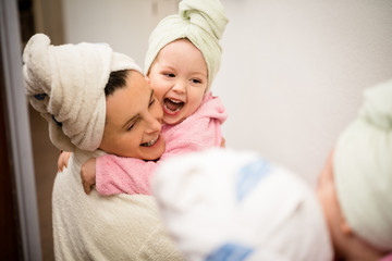 Mother and child - fun in bathrobes