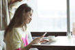 © byswat - Young girl, sitting in a cafe with cup of coffee