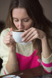 © byswat - Young girl, sitting in a cafe with cup of coffee