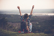 © Laszlo - Young woman watching landscape, posing outdoor. Active lifestyle concept. Arms up!