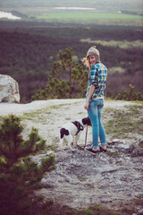 Wall Mural - Woman and her dog posing outdoor. 