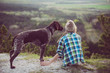 © Laszlo - Woman and her dog posing outdoor. Active lifestyle with dog.