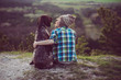 © Laszlo - Woman and her dog posing outdoor. Girl loving and hugging tightly her dog and watching landscape.