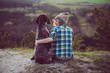 © Laszlo - Woman and her dog posing outdoor. Girl loving and hugging tightly her dog and watching landscape.