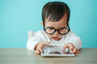 © DN6 - baby child using a pad./ Child playing with digital tablet on th
