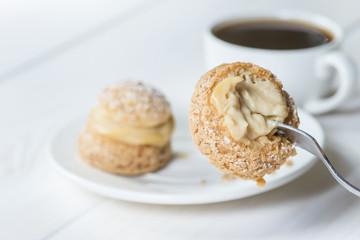 Wall Mural - piece of pastries shu on a fork, eating cake with coffee