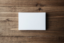 Photo Of Blank White Identity Stack. Empty Business Cards On Wood Table Background, Ready For Your Private Information. Horizontal Mockup    