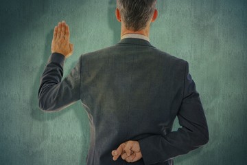 Wall Mural - Composite image of rear view of businessman taking oath