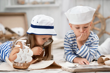 Children playing in the sailors in his room