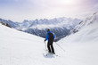 © NicoElNino - Skier skiing on snowy slope in Alps mountains near Chamonix